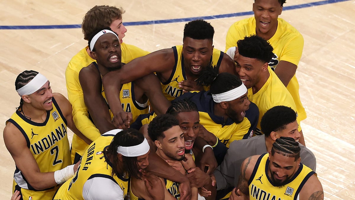 Tyrese Haliburton is mobbed by his teammates during the Indiana Pacers' 138-135 overtime win over the New York Knicks in Game 1 of the 2025 Eastern Conference Finals.