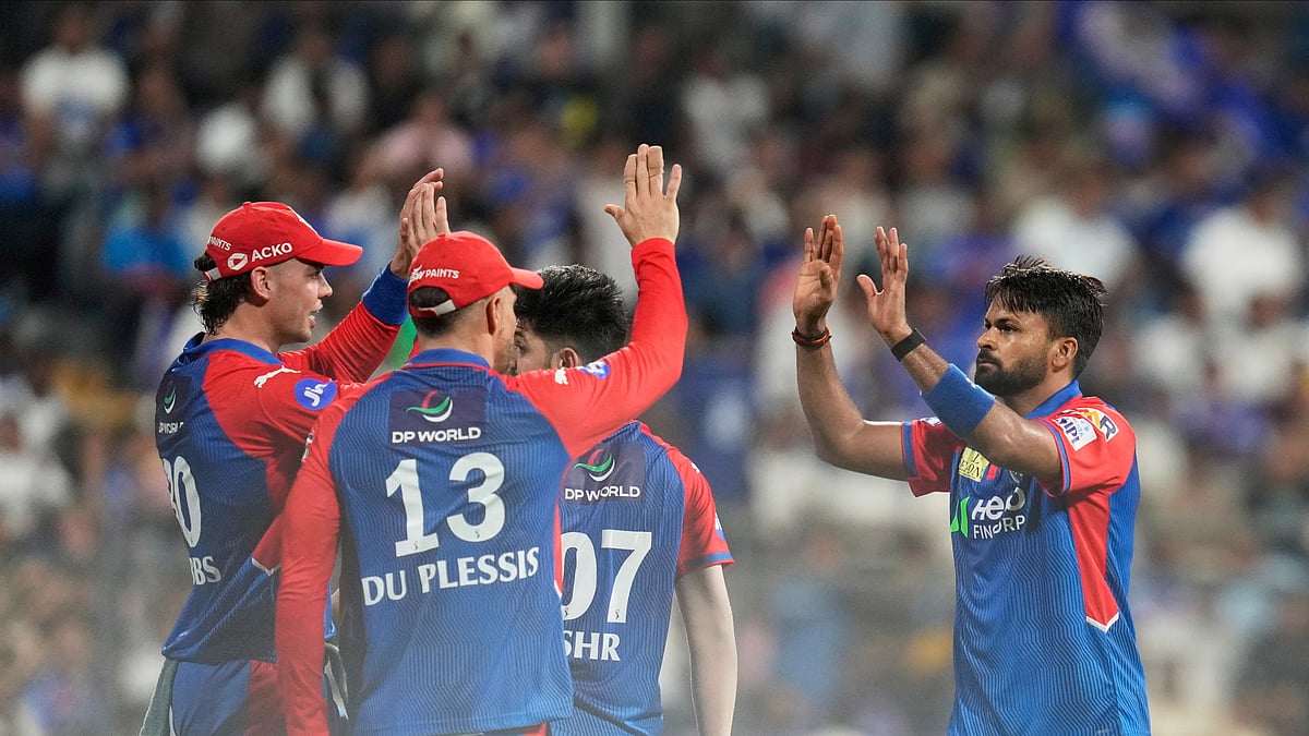 AP Photo/Rajanish Kakade : Delhi Capitals' Mukesh Kumar, right, celebrates with teammates after the dismissal of Mumbai Indians' Will Jacks during the Indian Premier League cricket match at Wankhede Stadium in Mumbai.