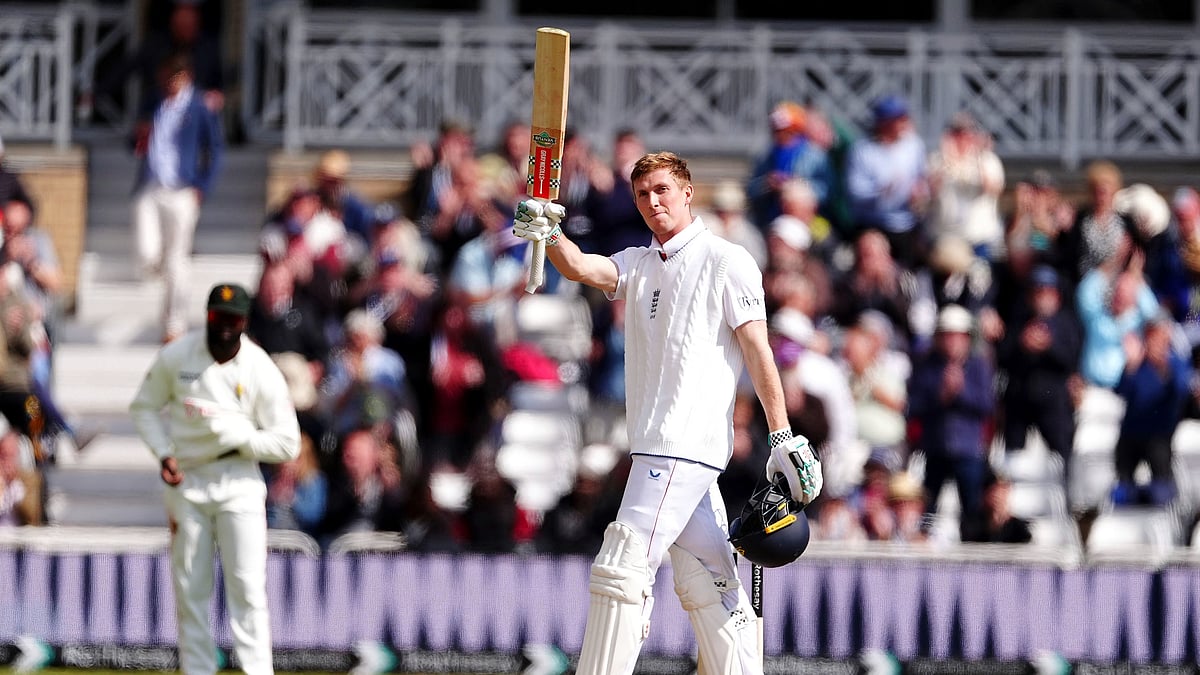 Englands Zak Crawley celebrates his century on day one. AP
