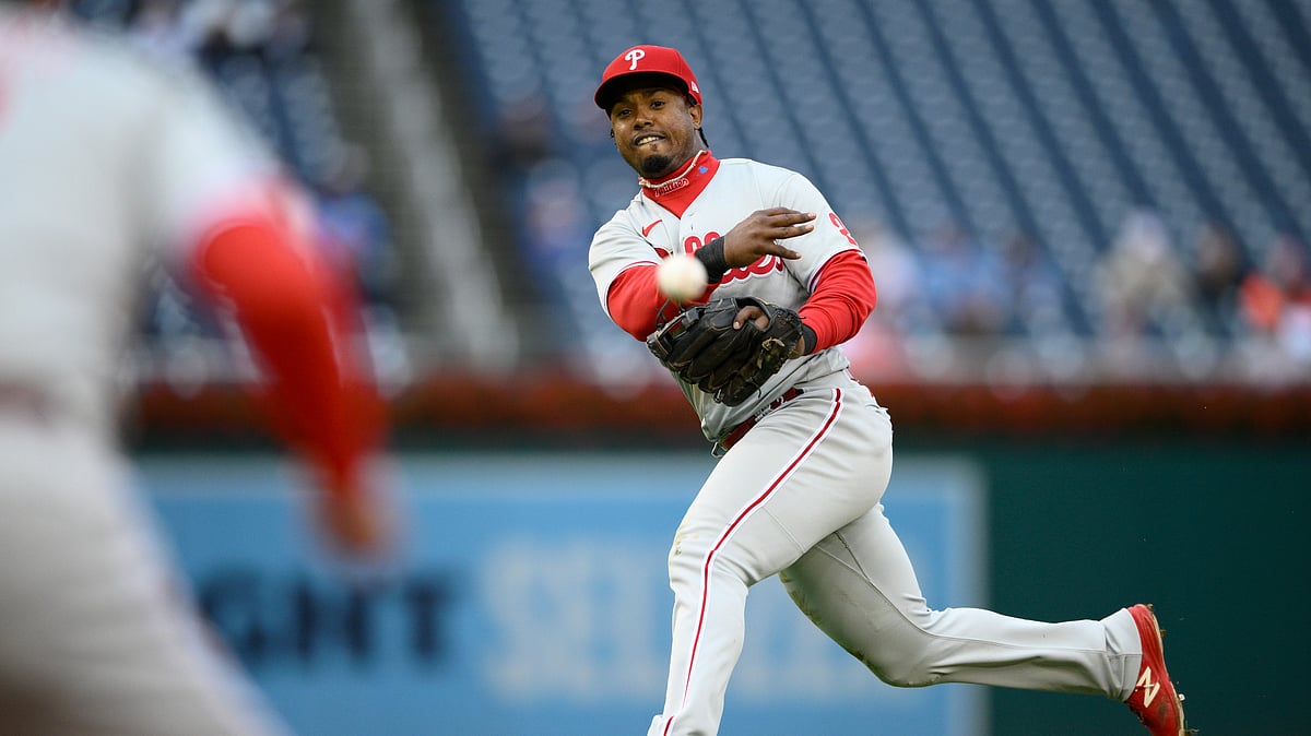 (AP Photo/Nick Wass, File)
 : FILE - Philadelphia Phillies second baseman Jean Segura throws to first but is unable to get Washington Nationals' CJ Abrams who singled during the eighth inning of the first baseball game of a doubleheader, Oct. 1, 2022, in Washington. 
