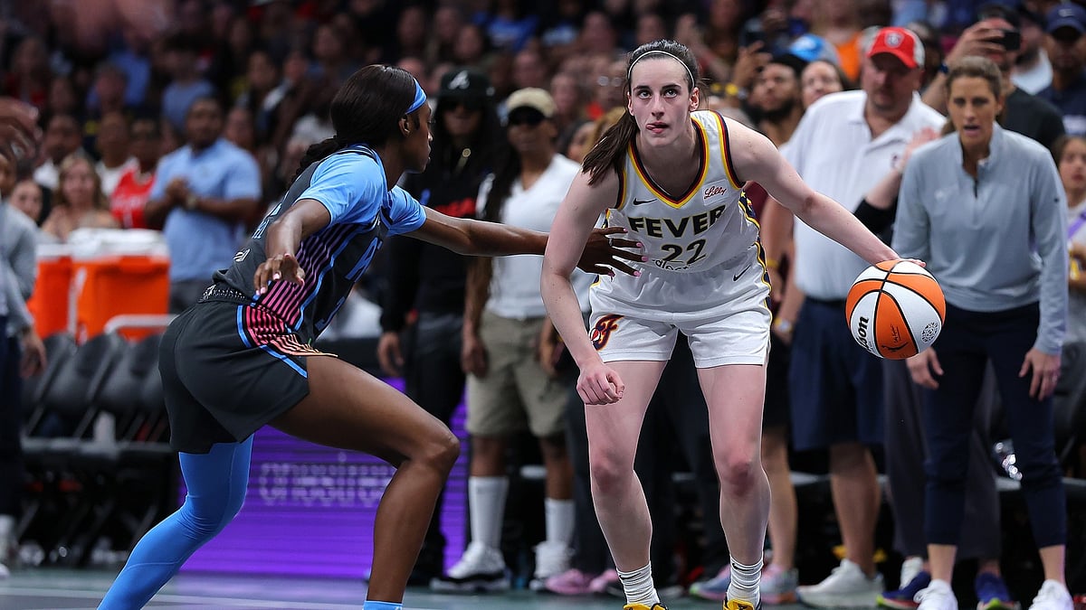 Caitlin Clark #22 of the Indiana Fever looks to drive against Maya Caldwell #33 of the Atlanta Dream during the fourth quarter at State Farm Arena on May 22, 2025 in Atlanta, Georgia.