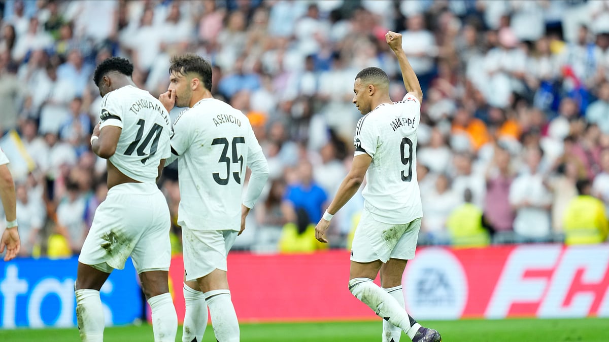 Real Madrids Kylian Mbappe, right, celebrates after scoring the opening goal. AP