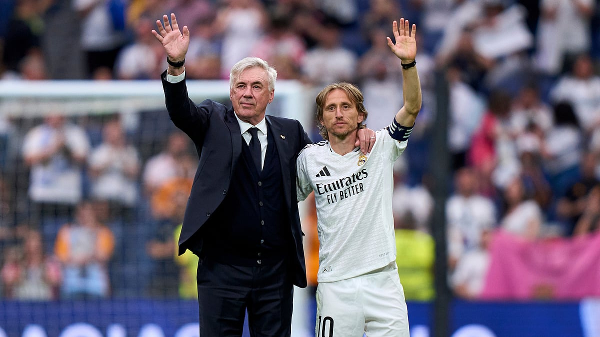Real Madrid's Carlo Ancelotti and Luka Modric
