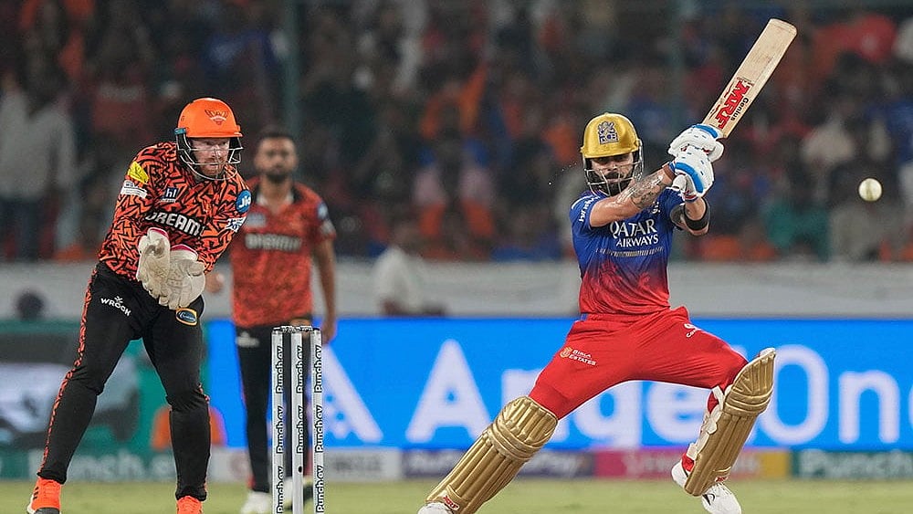 Photo: AP/Mahesh Kumar A. : IPL: RCB's Virat Kohli in action.