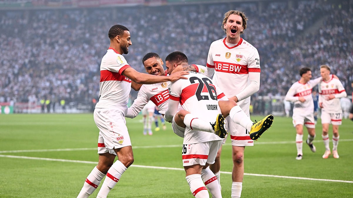 VfB Stuttgart players celebrate scoring against Arminia Bielefeld.