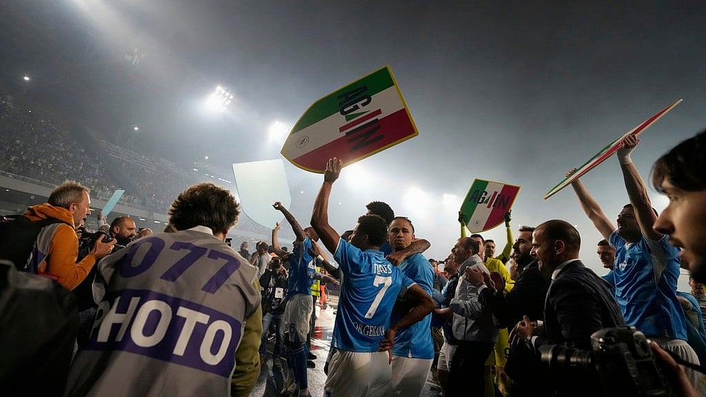 AP/Gregorio Borgia : Players celebrate at the end of the Italian Serie A soccer match between Napoli and Cagliari at the Diego Maradona stadium in Naples, Italy, Friday, May 23, 2025.