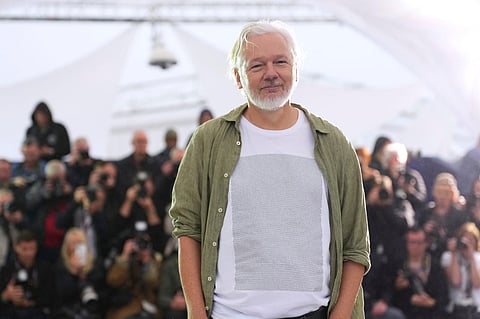 Julian Assange wears a white T-shirt with printed names of 4,986 Palestinian children killed in Israel’s war on Gaza.