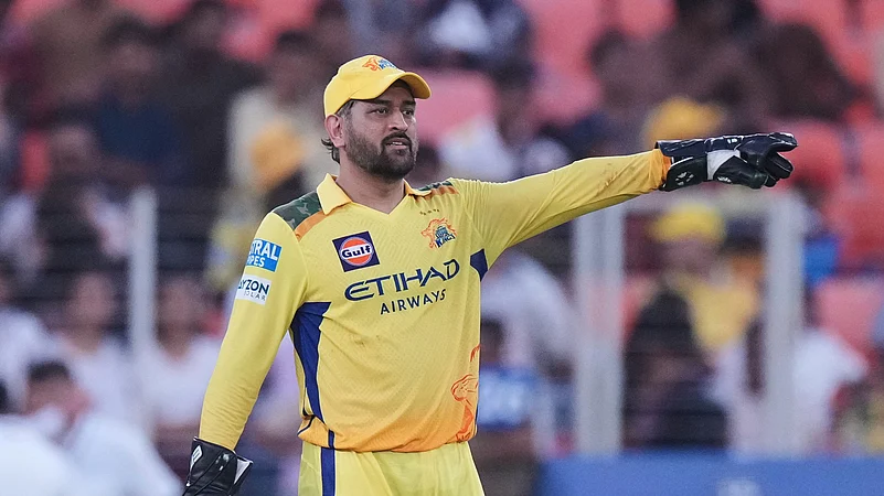 Chennai Super Kings captain Mahendra Singh Dhoni arranges the field. AP