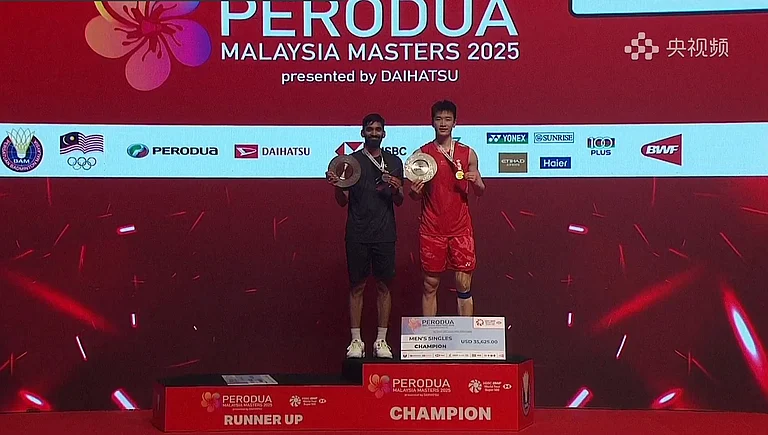 Kidambi Srikanth with runners-up medal at the podium. - X/BadmintonJust