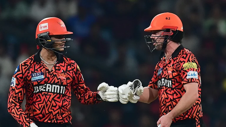Sunrisers Hyderabad's Abhishek Sharma and Travis Head give gloves touch during the Indian Premier League cricket match in Lucknow. - AP Photo