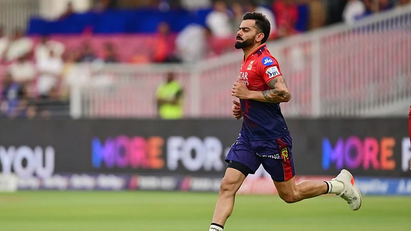 Virat Kohli warming up.