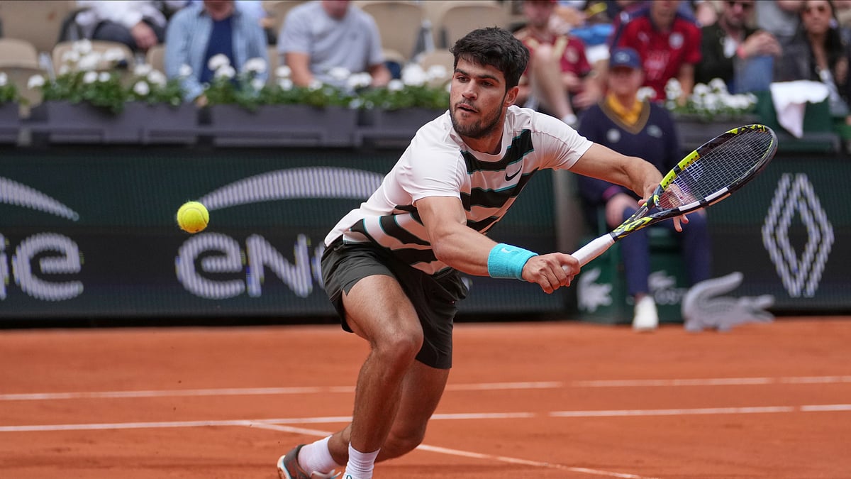 (AP Photo/Thibault Camus)

 : Spain's Carlos Alcaraz returns the ball to Italy's Giulio Zeppieri during their first round match of the French Tennis Open, at the Roland-Garros stadium, in Paris, Monday, May 26, 2025. 
