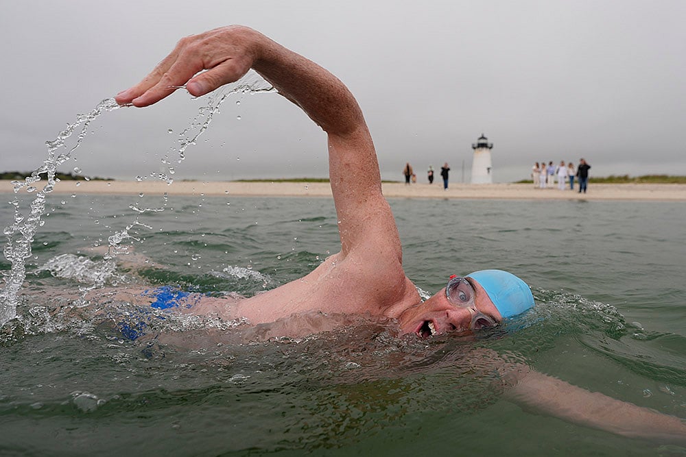 | Photo: AP/Robert F. Bukaty : Jaws Anniversary Shark Swim