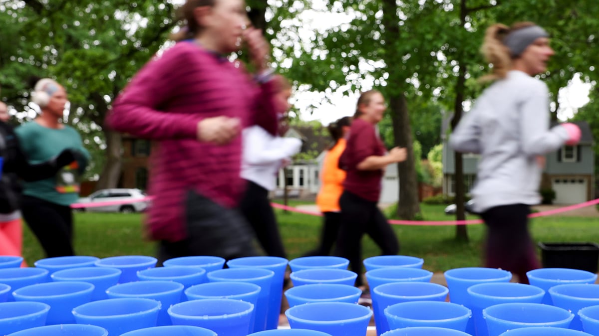  (AP Photo/Ellen Schmidt)

 : Runners pass a table with reusable silicone cups from Hiccup during the PNC Women Run the Cities race on Saturday, May 17, 2025, in Minneapolis.
