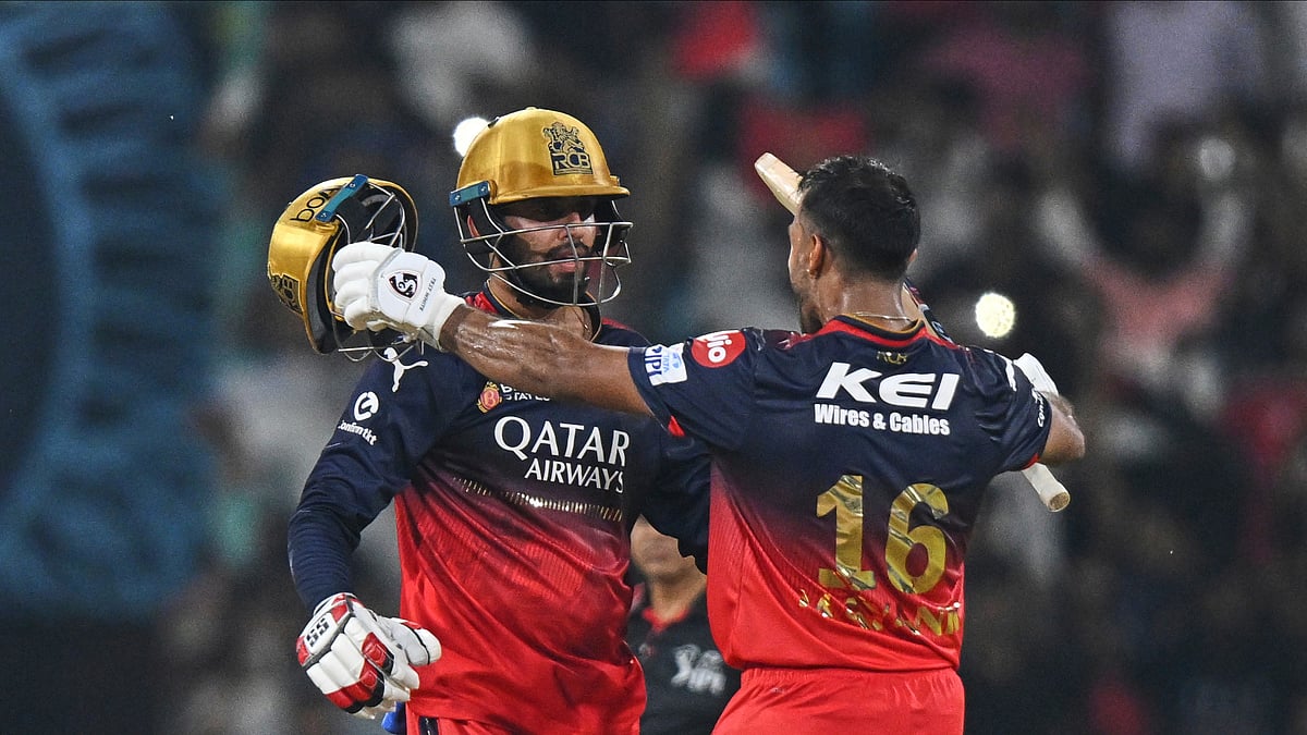AP Photo : Royal Challengers Bengaluru's Jitesh Sharma, left, and Mayank Agarwal celebrate after winning the Indian Premier League cricket match against Lucknow Super Giants at Atal Bihari Vajpayee Ekana Cricket Stadium in Lucknow.