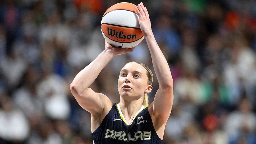 AP : Dallas Wing's Paige Bueckers takes an outside shot on basket during a WNBA basketball game against the Connecticut Sun.