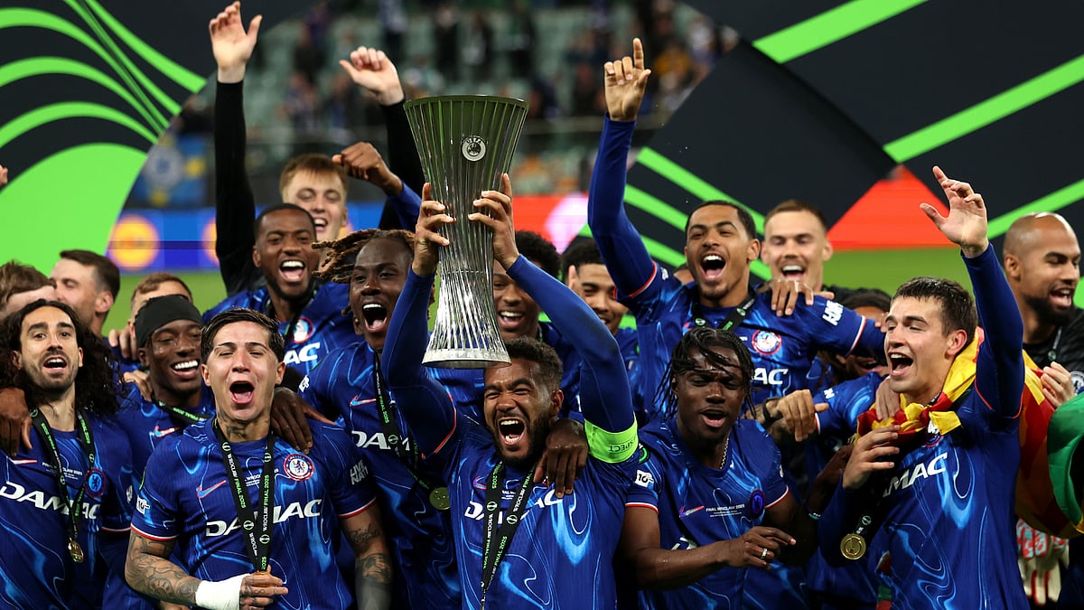 Reece James lifts the Conference League trophy