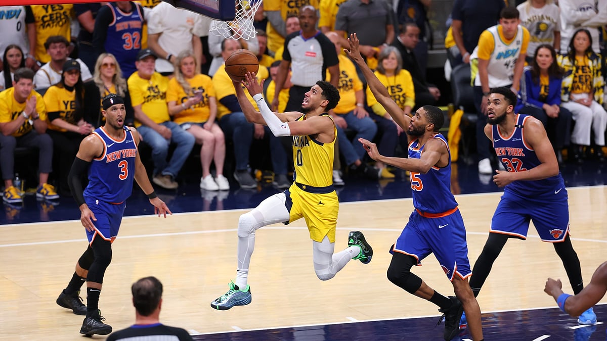 Tyrese Haliburton #0 of the Indiana Pacers drives to the basket against Mikal Bridges #25 of the New York Knicks during the fourth quarter in Game Four of the Eastern Conference Finals of the 2025 NBA Playoffs at Gainbridge Fieldhouse on May 27, 2025 in Indianapolis, Indiana.
