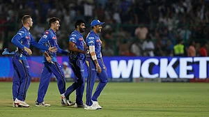 AP Photo/Surjeet Yadav : Mumbai Indians' Jasprit Bumrah, second right, and teammates celebrate the dismissal of Punjab Kings' Prabhsimran Singh during the Indian Premier League cricket match in Jaipur.