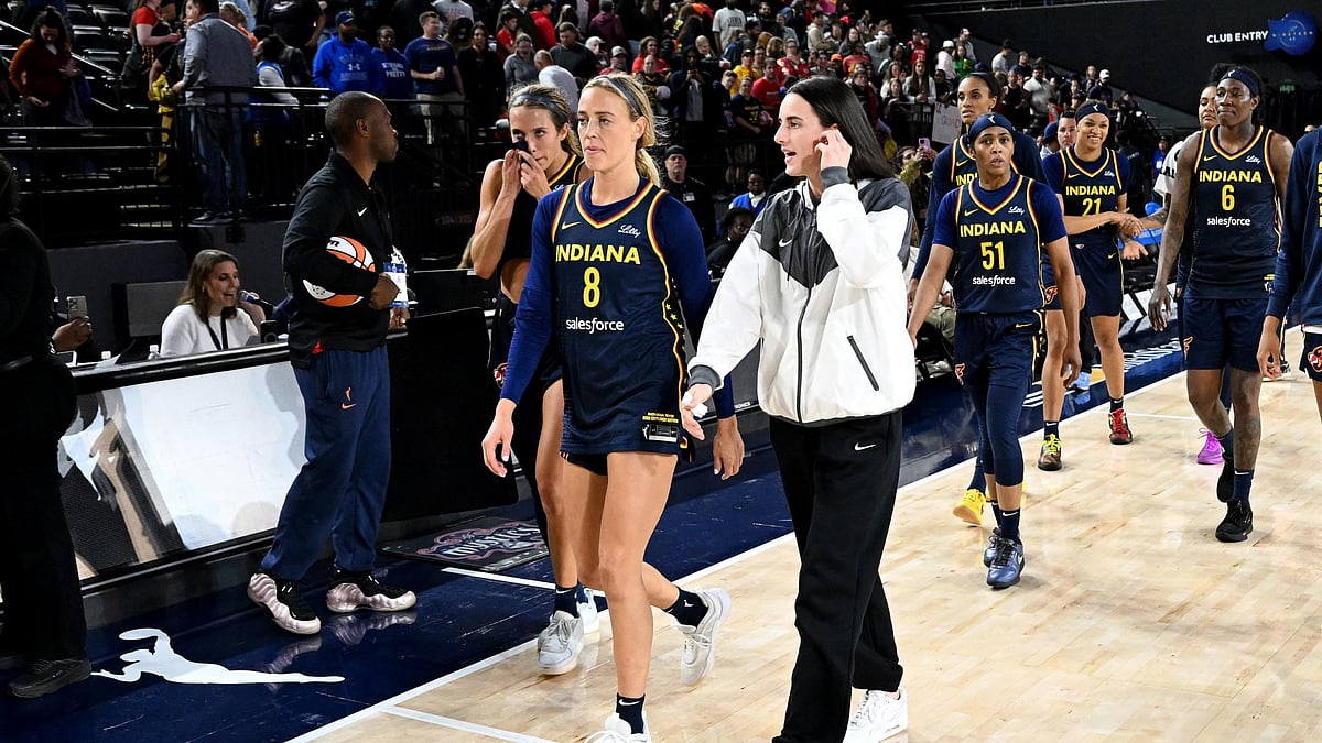 Caitlin Clark (centre right) is out injured