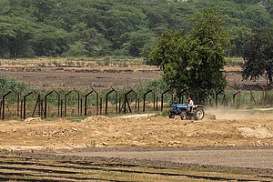| Photo: Vikram Sharma : This Side, That Side: A farmer works in his field along the India-Pakistan border in Punjab