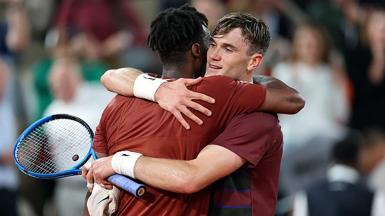 Gael Monfils and Jack Draper hug after their French Open second-round match. - null
