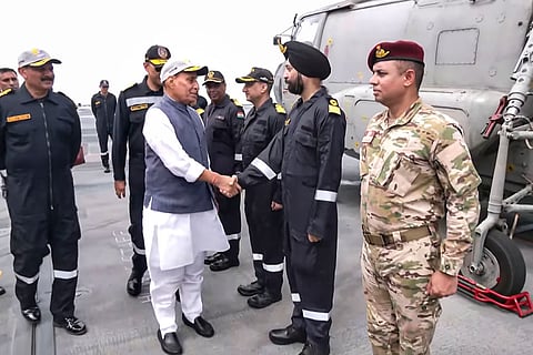 Rajnath Singh meets naval officers aboard INS Vikrant