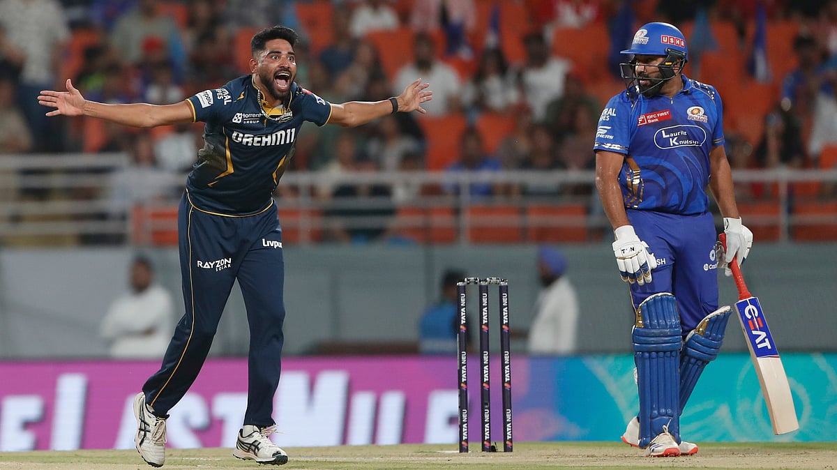 (AP Photo)
 : Gujarat Titans' Mohammed Siraj, left, appeals unsuccessfully for the wicket of Mumbai Indians' Rohit Sharma, right, during the Indian Premier League eliminator cricket match between Mumbai Indians and Gujarat Titans at Maharaja Yadavindra Singh Cricket Stadium in Mohali, India, Friday, May 30, 2025. 

