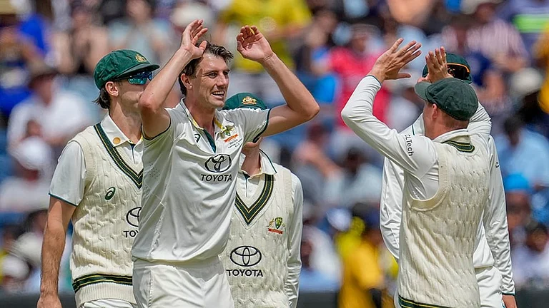 Australia's captain Pat Cummins celebrates with his teammates - | Photo: AP/Asanka Brendon Ratnayake