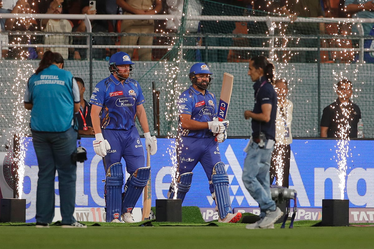 Mumbai Indians' Rohit Sharma, right, and batting partner Jonny Baristow walk onto the field to bat during the Indian Premier League eliminator cricket match between Mumbai Indians and Gujarat Titans at Maharaja Yadavindra Singh Cricket Stadium in Mohali, India, Friday, May 30, 2025. 

