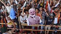 | Suresh Pandey | : People holding cutout of Prime Minister Narendra modi in a political rally in Bihar ahead of state elections.