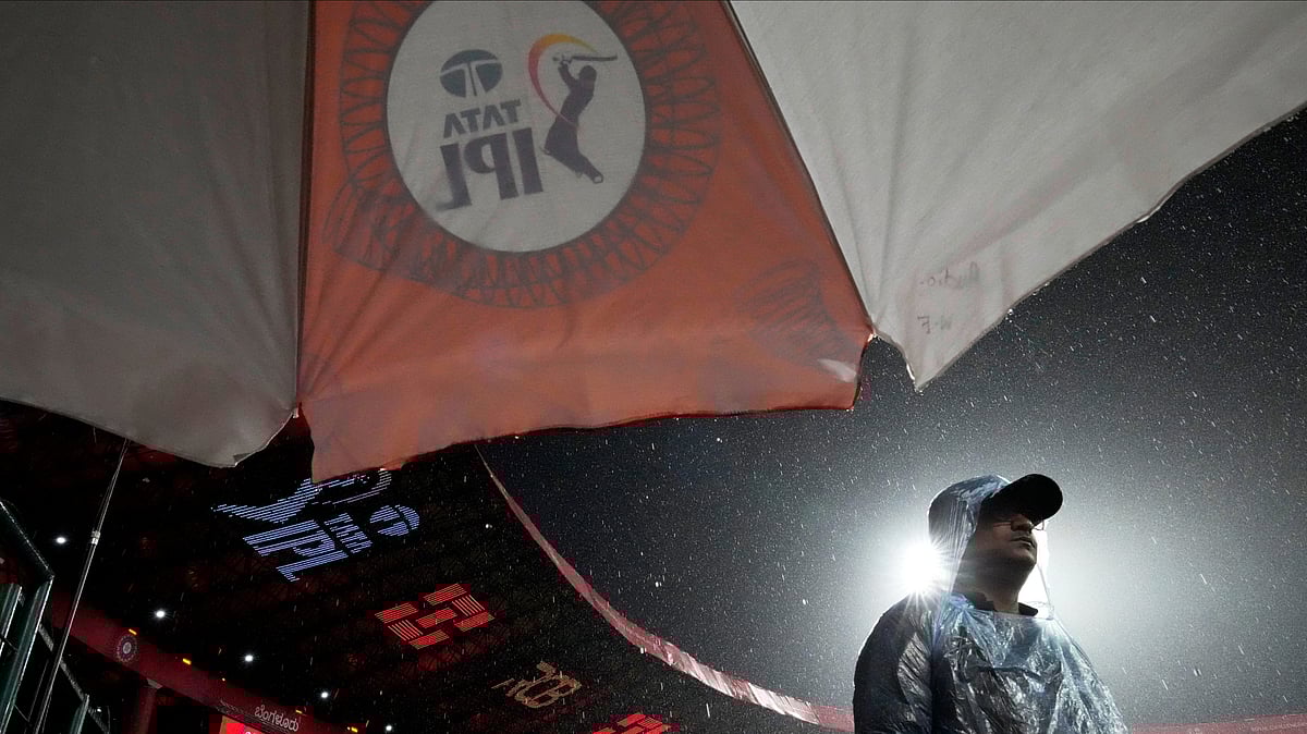 | Photo: AP/Aijaz Rahi : File photo of rainfall at the M. Chinnaswamy Stadium during an IPL 2025 match.