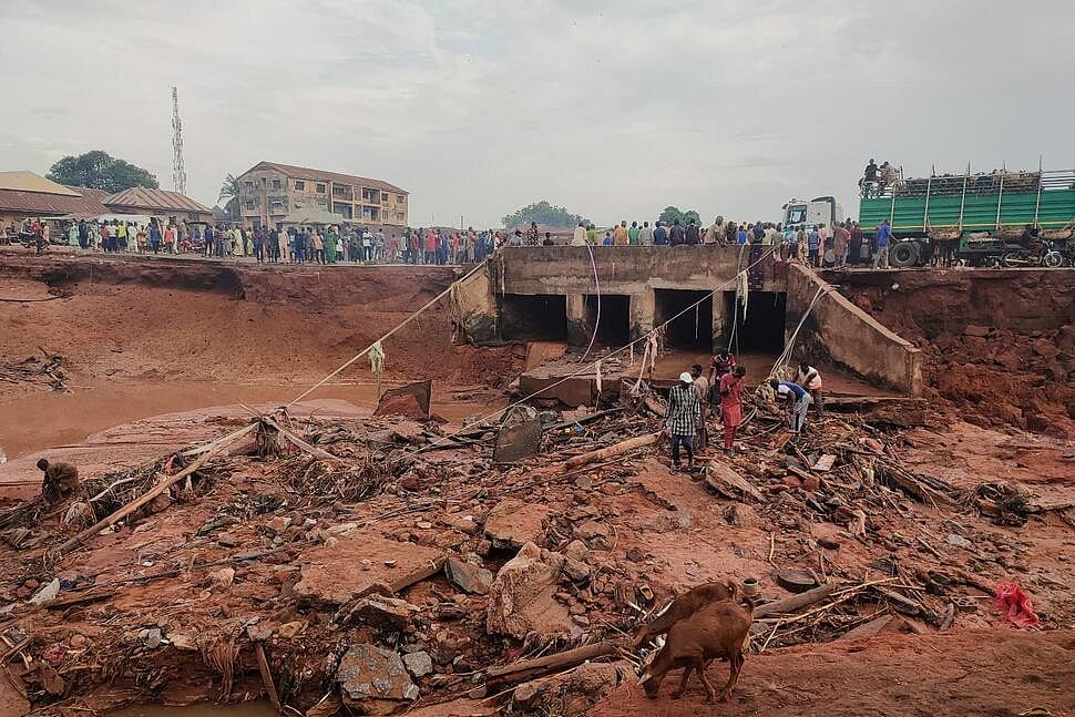  | AP/Chenemi Bamaiyi : People search in flooded area following a downpour in Mokwa, Nigeria, Friday, May 30, 2025.