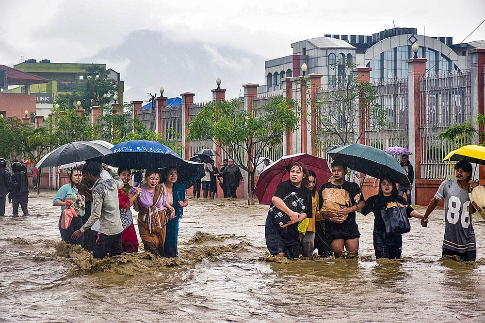 | Photo: PTI : Weather: Waterlogging and rain in Manipur