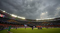 AP Photo/Ajit Solanki : Dark clouds were seen above the Narendra Modi Stadium before the start of the Indian Premier League cricket match between Punjab Kings and Mumbai Indians in Ahmedabad.