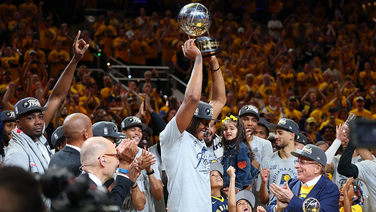 Myles Turner #33 of the Indiana Pacers celebrates with the trophy after the 125-108 win against the New York Knicks in Game Six of the Eastern Conference Finals of the 2025 NBA Playoffs at Gainbridge Fieldhouse on May 31, 2025 in Indianapolis, Indiana.