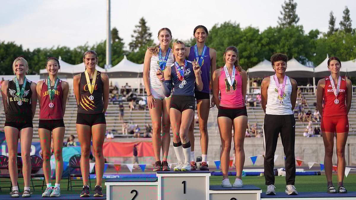 (AP Photo/Jae C. Hong)

 : AB Hernandez, center, flashes a sign as she shares the first-place spot on the podium with Jillene Wetteland, left, and Lelani Laruelle during a medal ceremony for the high jump at the California high school track-and-field championships in Clovis, Calif., Saturday, May 31, 2025. 