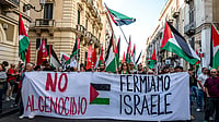 Photo by Fabrizio Villa/Getty Images : “No to genocide – Stop Israel” translated reads the lead banner of the Catania for Palestine march along Via Etnea on May 25, 2025 in Catania, Italy. Demonstrators gathered on Sunday in Catania to show support for Palestinians in Gaza, demanding an immediate ceasefire in the region.