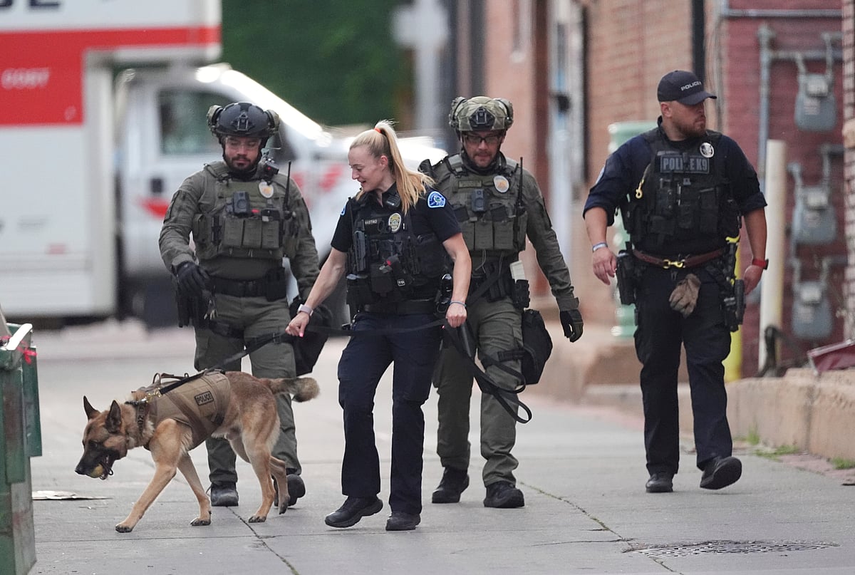 Law enforcement officials investigate after an attack on the Pearl Street Mall Sunday, June 1, 2025, in Boulder, Colo.  - AP Photo/David Zalubowski