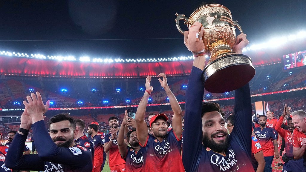 Royal Challengers Bengaluru's captain Rajat Patidar celebrates with the winners trophy after their win in the Indian Premier League 2025 final against Punjab Kings at Narendra Modi Stadium in Ahmedabad. - | Photo: AP
