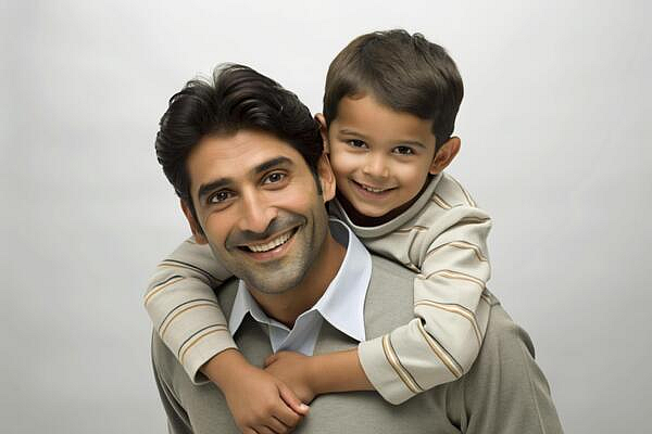 A Stepfather Holding His Son On His Shoulder