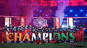 AP/Ajit Solanki : Royal Challengers Bengaluru players celebrate with the winners trophy after their win in the Indian Premier League final cricket match against Punjab Kings at Narendra Modi Stadium in Ahmedabad, India, Wednesday, June 4, 2025.