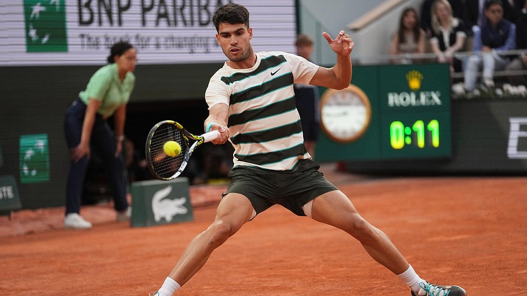 Photo: AP : Spain's Carlos Alcaraz plays a shot against Tommy Paul of the U.S.A during their quarter-final match of the French Open at the Roland-Garros stadium in Paris.