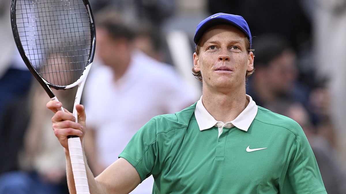 Jannik Sinner acknowledges the fans at the French Open after his quarter-final win