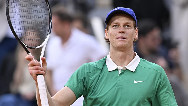 Jannik Sinner acknowledges the fans at the French Open after his quarter-final win