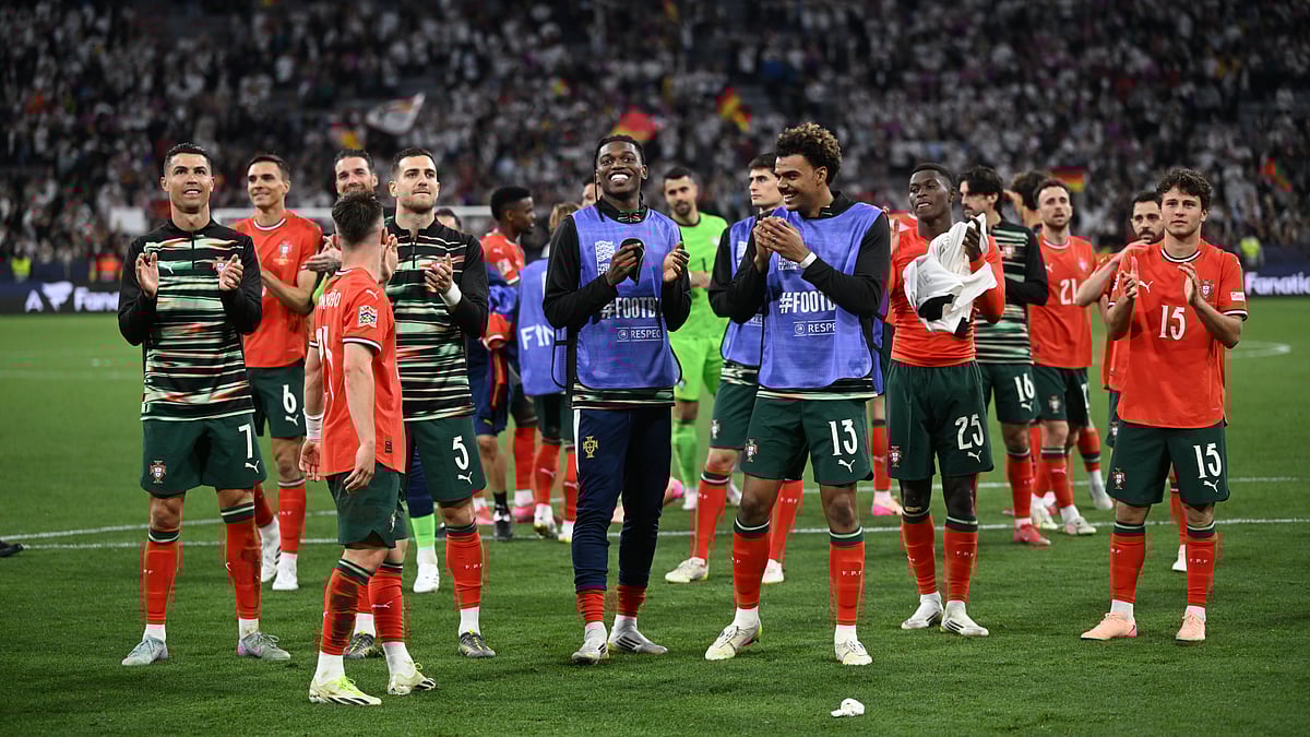 File : Portugal's players applaud their fans after beating Germany.