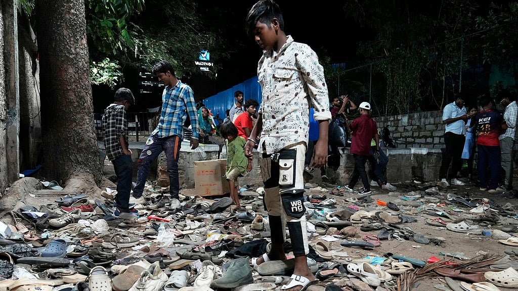 (AP Photo/Aijaz Rahi) : People rummage through footwear strewn outside M. Chinnaswamy Stadium after a stampede caused by frenzied fans celebrating Royal Challengers Bengaluru's victory in the Indian Premier League cricket tournament, in Bengaluru, India, Wednesday, June 4, 2025. 