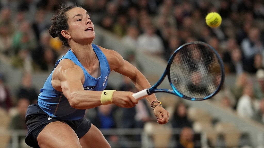 Photo: AP : France's Lois Boisson plays a shot against Russia's Mirra Andreeva during their quarter-final match of the French Open at the Roland Garros stadium in Paris.