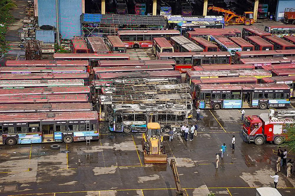 | Photo: PTI : Fire at bus depot