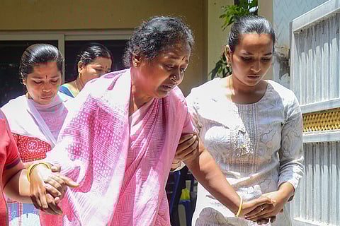 Relatives and friends pay tribute to a victim in Bengaluru